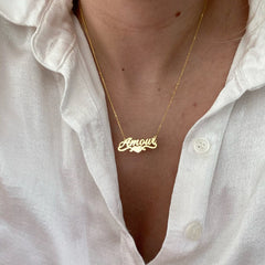 Model wearing personalized copper necklace with heart charm