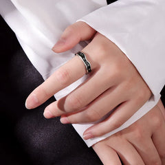 Close-up of star motif on wave-shaped platinum fashion ring