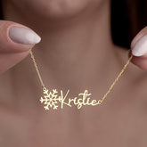 Model wearing personalized snowflake name necklace with winter outfit