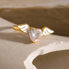 Celestial Heart – 18K Gold Angel Wings with Heart-Shaped Gemstone Ring