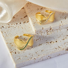 Model wearing simple gold twisted ring styled with both formal and casual wear