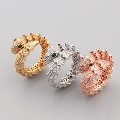 18K gold snake-shaped open ring with gemstone inlay on scales and eyes