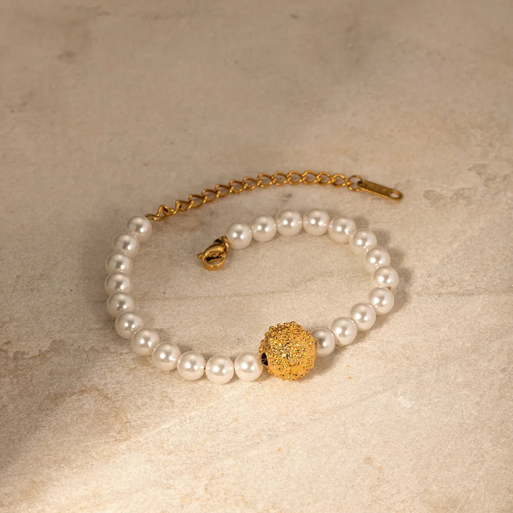Regal Bloom – 18K Gold Hammered Flower and Pearl Design Bracelet