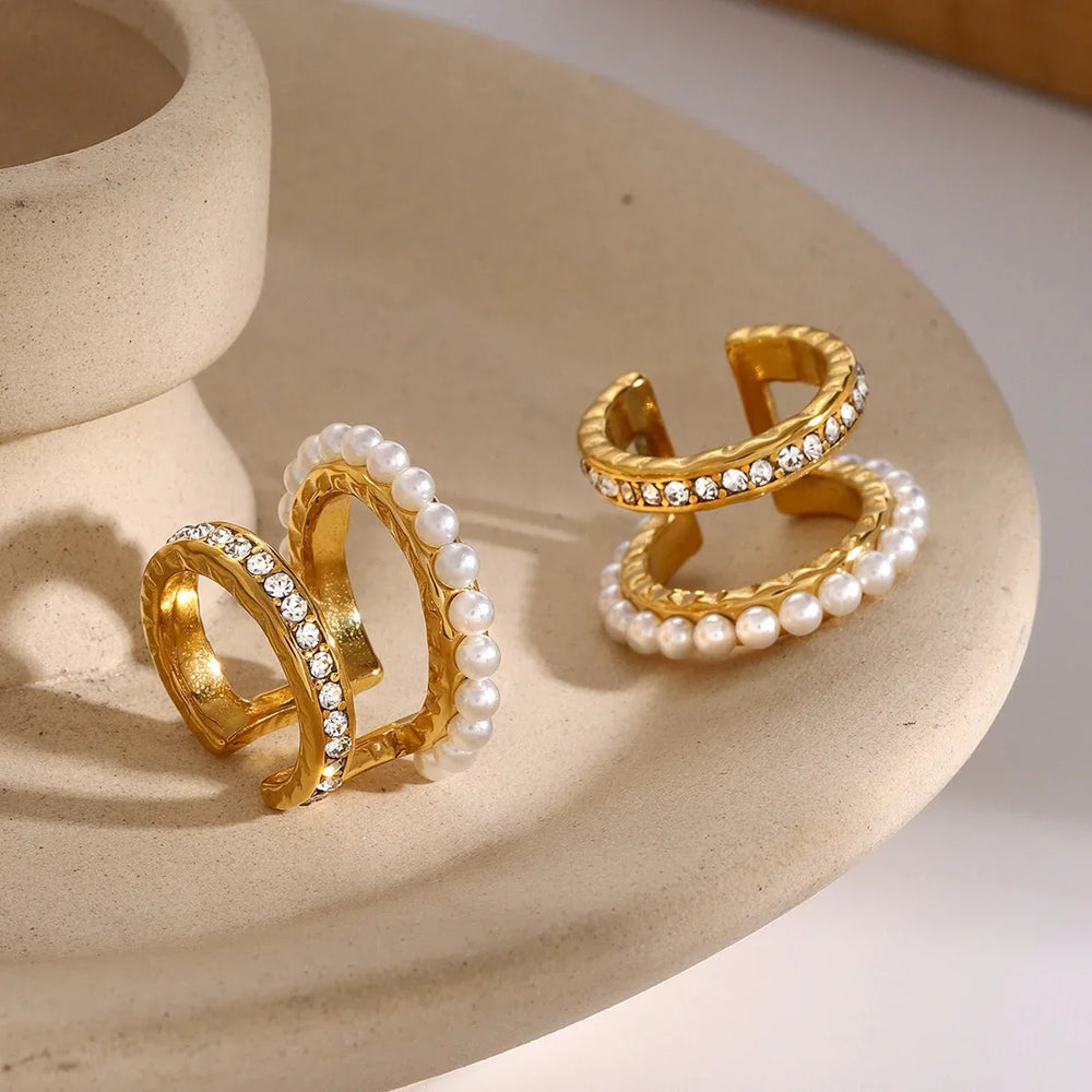 Front view of Éclat double-layer gold earrings with pearls and diamond accents