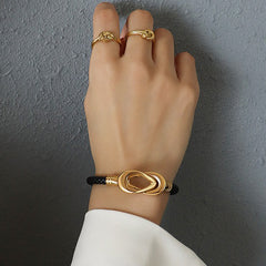 Model wearing Liora bracelet styled with blazer and minimalist rings