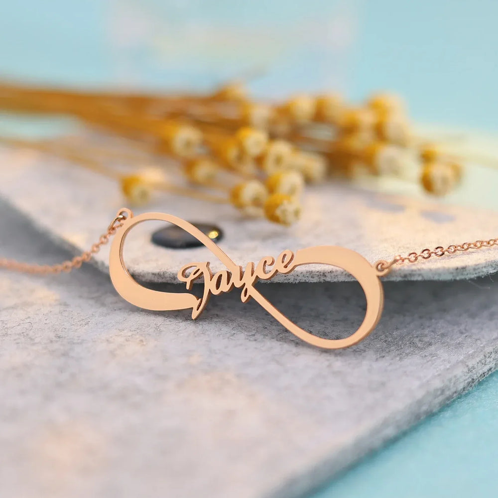 Silver infinity symbol necklace with customizable name engraving