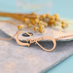 Silver infinity symbol necklace with customizable name engraving