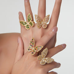 Model wearing elegant gold butterfly ring for formal or everyday wear