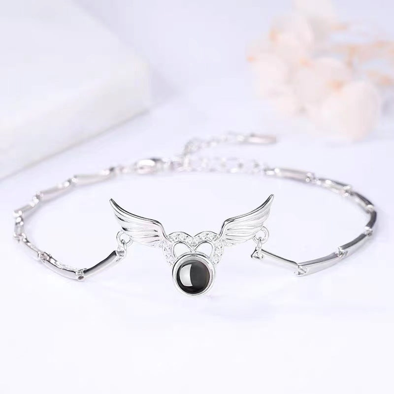 Celestial Angel Wings Projection Bracelet – Elegant Memory Jewelry Bracelets