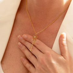 Model wearing silver birthday flower name necklace with elegant outfit