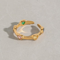 Elegant open ring with zircon heart inlays in gold