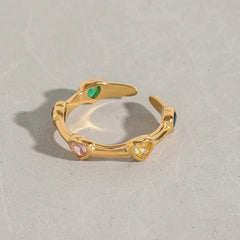 Elegant open ring with zircon heart inlays in gold