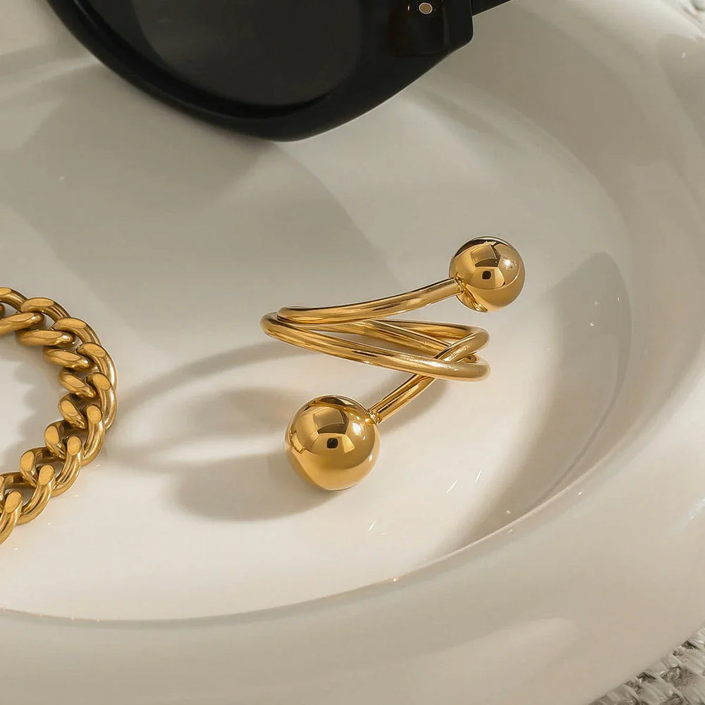 18K gold geometric ring with asymmetrical spherical design