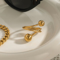 18K gold geometric ring with asymmetrical spherical design