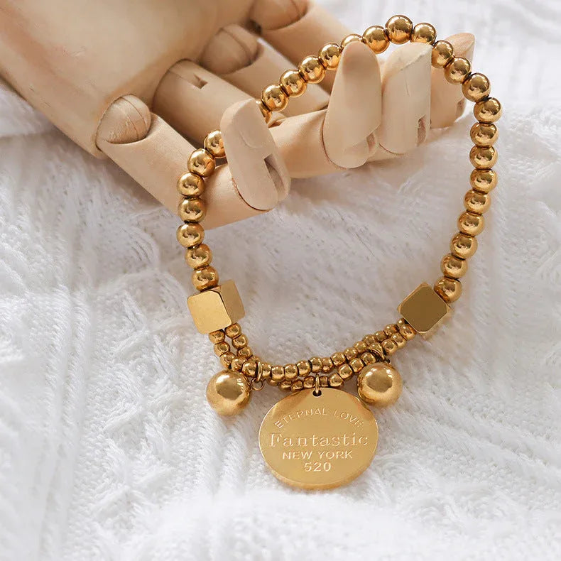 Golden Echo – 18K Gold Beaded Bracelet with Retro Coin Charm