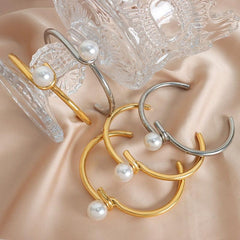 Model wearing minimalist twisted pearl gold bracelet with casual outfit