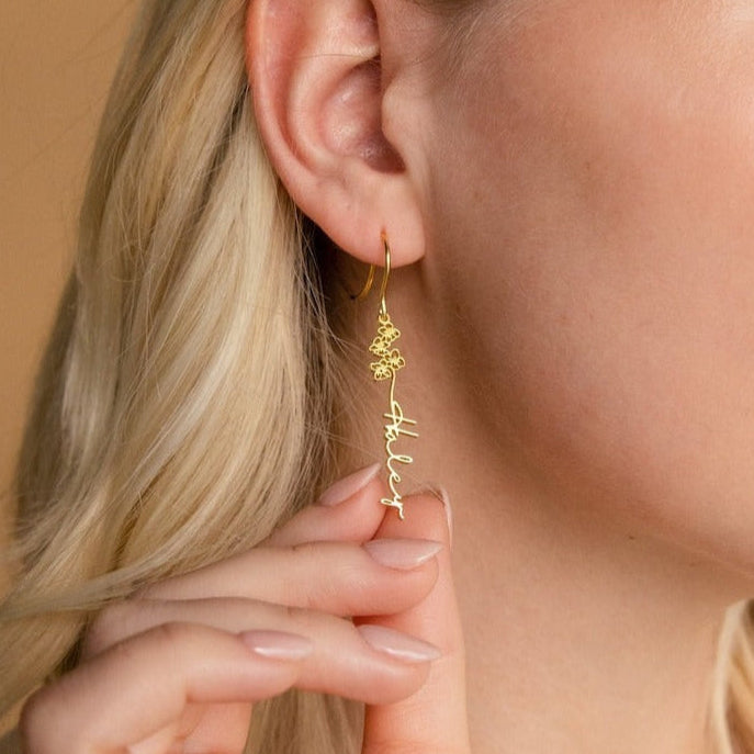 Model wearing personalized flower-shaped earrings with elegant styling