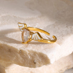Celestial Heart – 18K Gold Angel Wings with Heart-Shaped Gemstone Ring