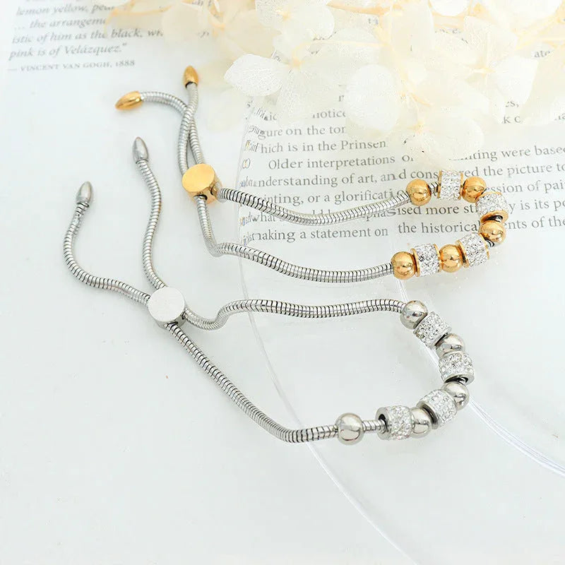 Regal Sphere – 18K Gold Round Beads and Cylindrical Diamond Bracelet