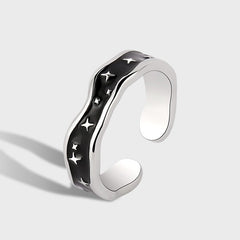 Platinum-plated open ring with wave line design and star accent