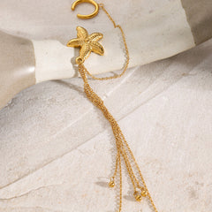 Side view of golden tassel earrings showing movement and layered detail