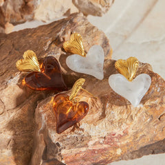 Women’s heart-shaped gold earrings with smooth romantic silhouette