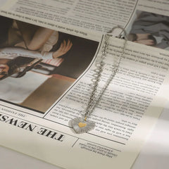 Fashion necklace with textured heart pendant