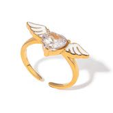 Celestial Heart – 18K Gold Angel Wings with Heart-Shaped Gemstone Ring
