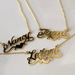 Close-up of engraved heart pendant with cursive name text