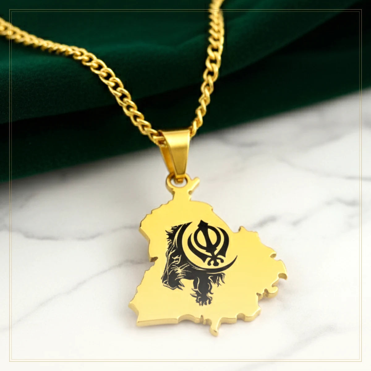 Gold-plated personalised Punjab map pendant necklace on white marble
