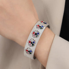 Sparkling diamond-set floral pattern on Floral Grace 18K Gold Bracelet
