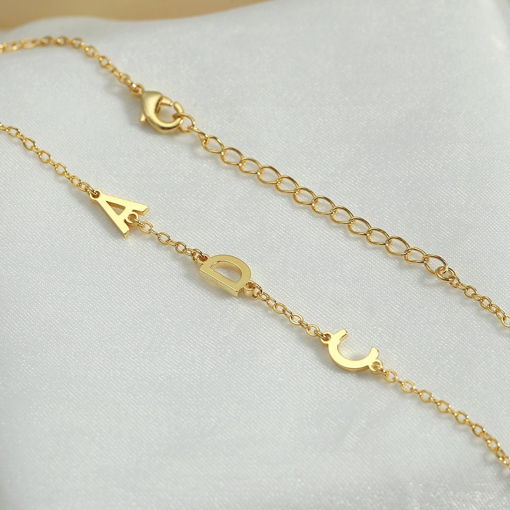 Detailed view of custom name engraving on Signature Whisper Bracelet
