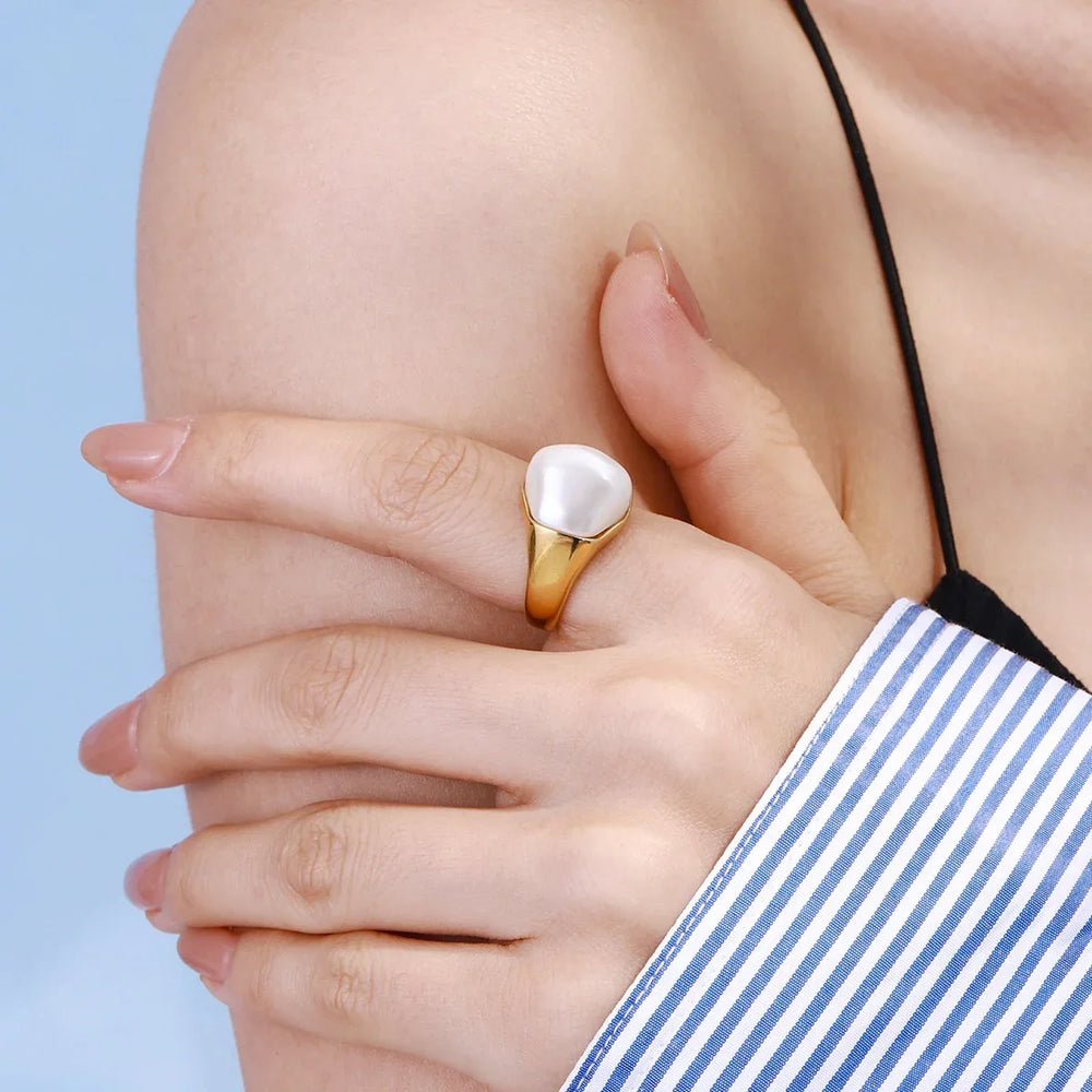 Modern gold ring with unique irregular pearl inlays