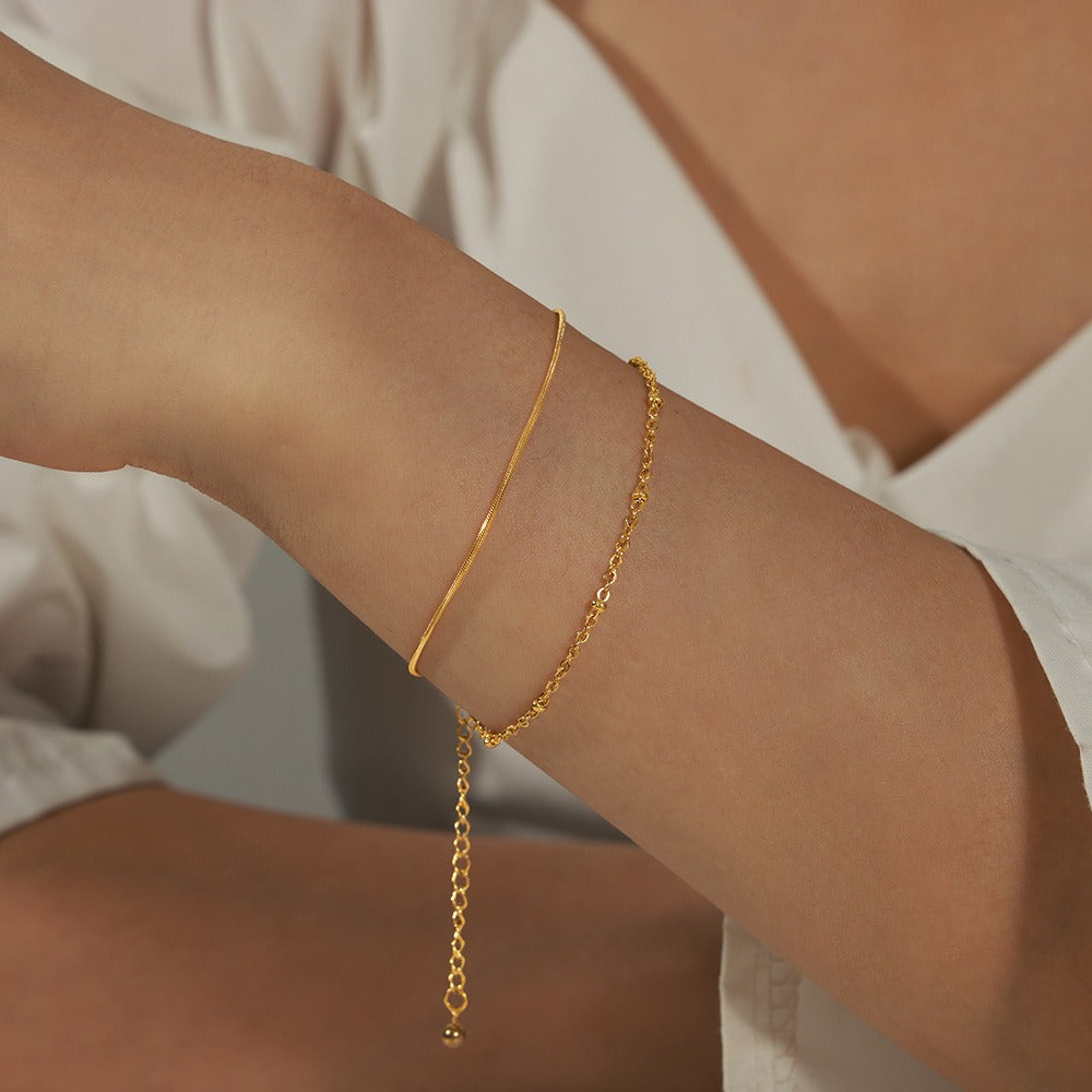 Timeless Layers bracelet crafted with minimalist double-layer structure in 18K gold
