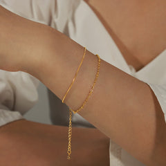 Timeless Layers bracelet crafted with minimalist double-layer structure in 18K gold