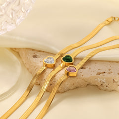 Pink heart-shaped zircon center on gold-plated bracelet