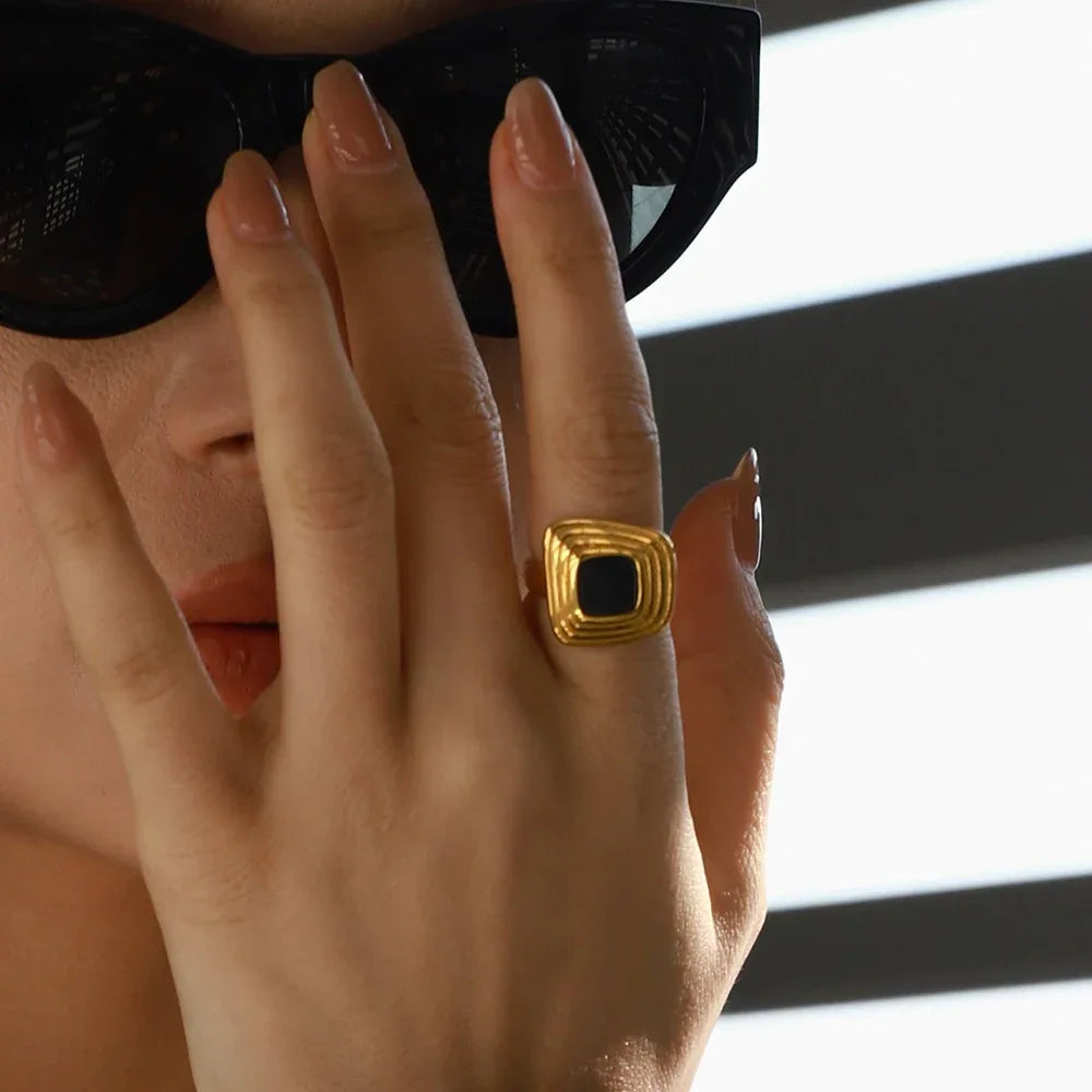 Textured gold ring with geometric lines for modern elegance