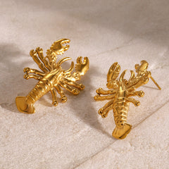 Sculpted gold lobster earrings with dimensional details