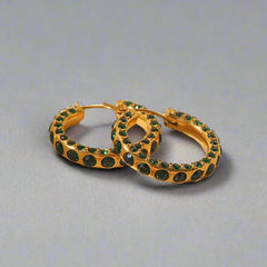 Minimalist round gold earrings with sparkling diamond accents