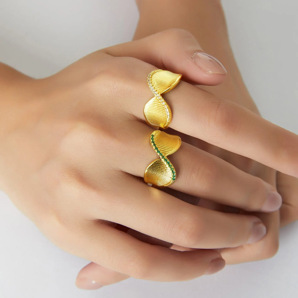 Close-up of smooth twist in gold ring with small diamond accent