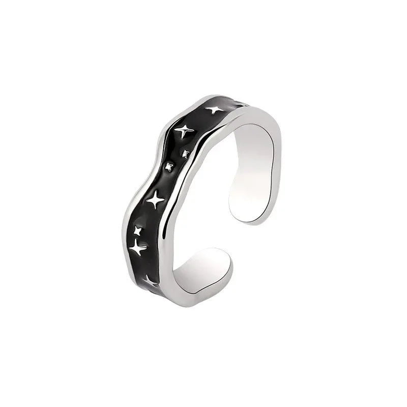 Wave and star fashion ring displayed on minimal background in soft lighting