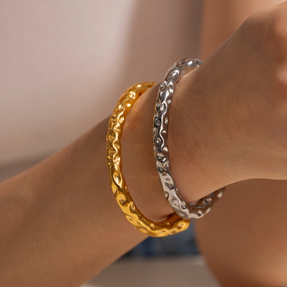 Elegant Golden Forge Bracelet with artisan hammer pattern design