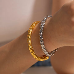 Elegant Golden Forge Bracelet with artisan hammer pattern design