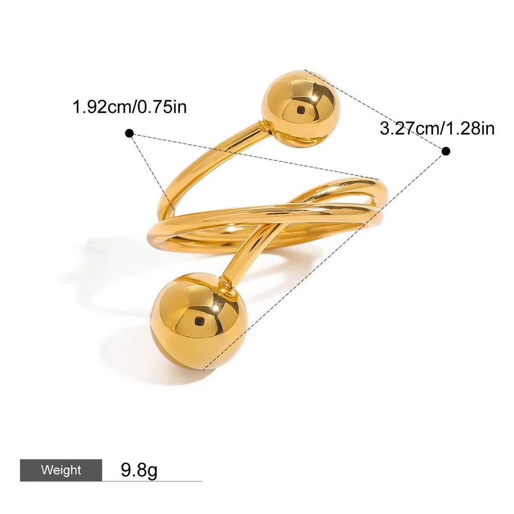 Asymmetrical gold ring with geometric lines and spheres