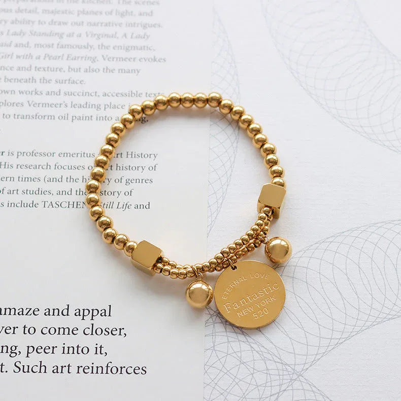 Golden Echo – 18K Gold Beaded Bracelet with Retro Coin Charm