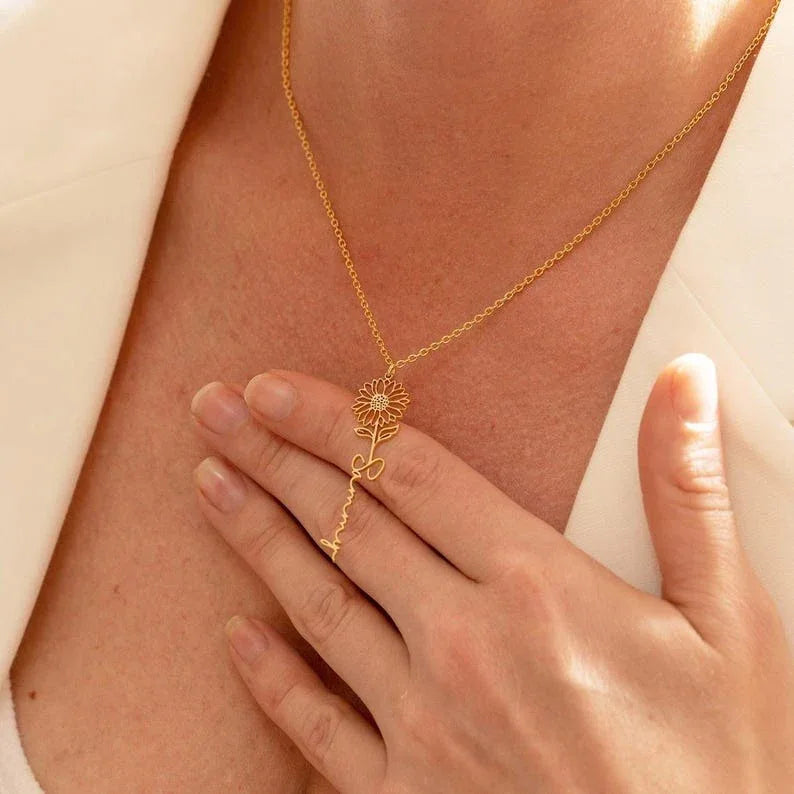 Model wearing silver birthday flower name necklace with elegant outfit