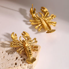 Statement lobster earrings styled for editorial fashion look