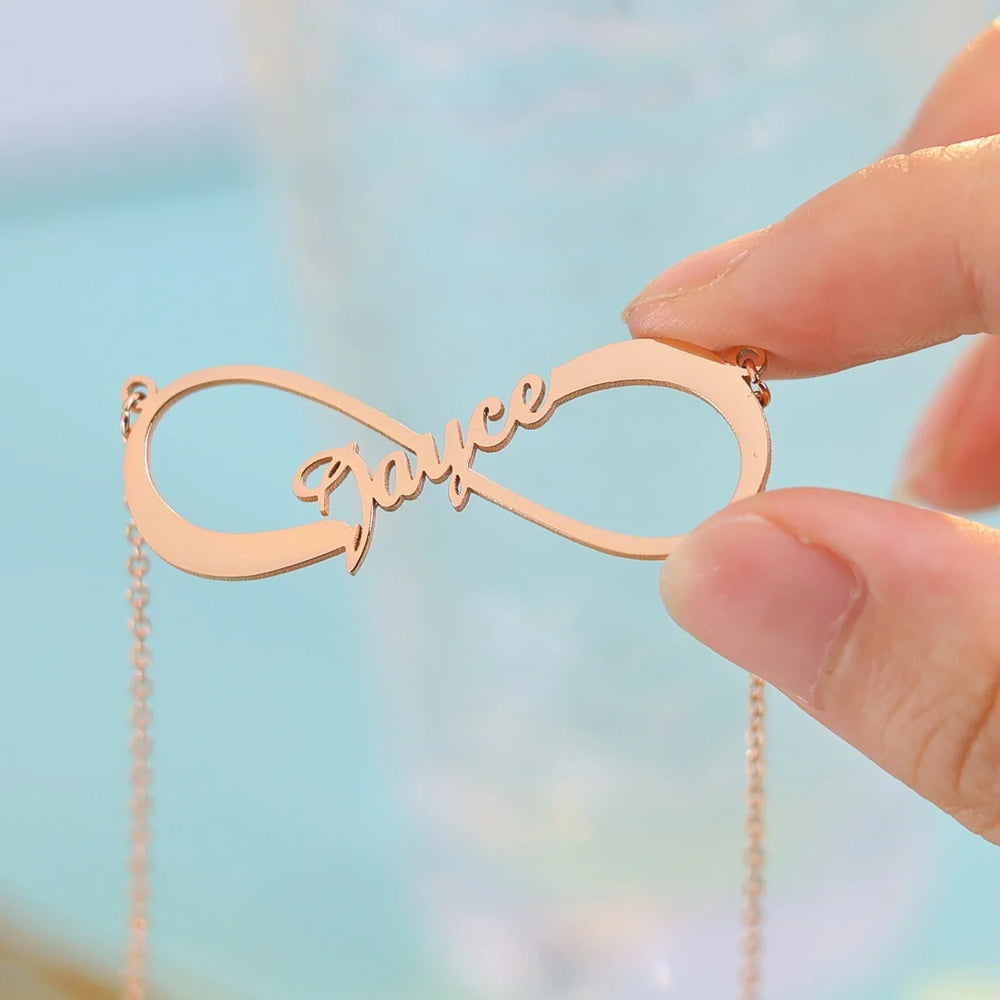 Model wearing custom infinity name silver necklace with casual outfit