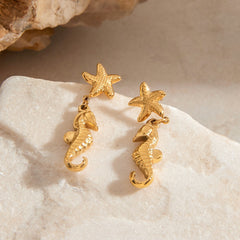 18K gold seahorse and starfish marine-inspired earrings