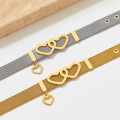 Romantic heart motif and strap-inspired styling on Eternal Bond 18K Gold Bracelet